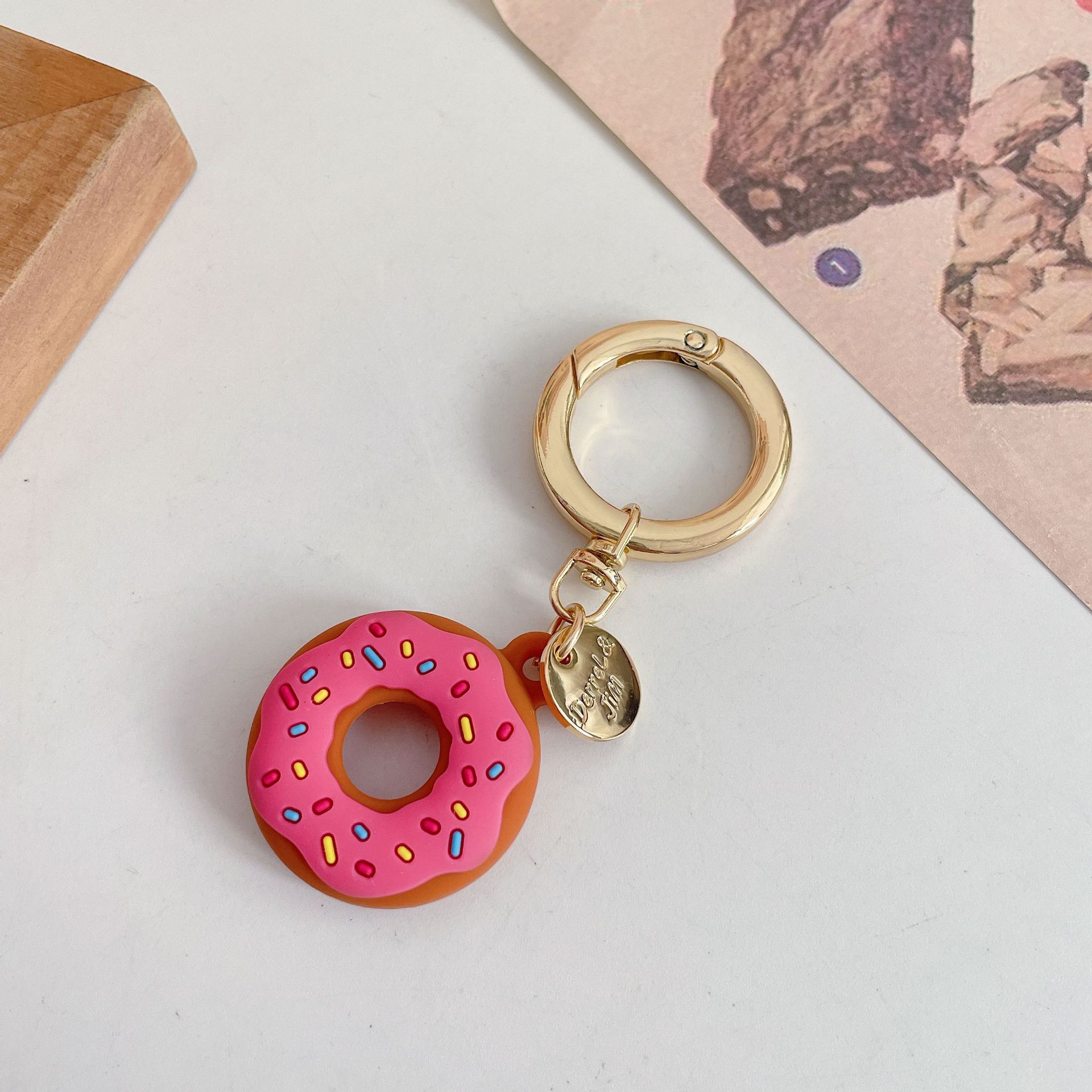 Funda protectora de silicona creativa para localizador de donas