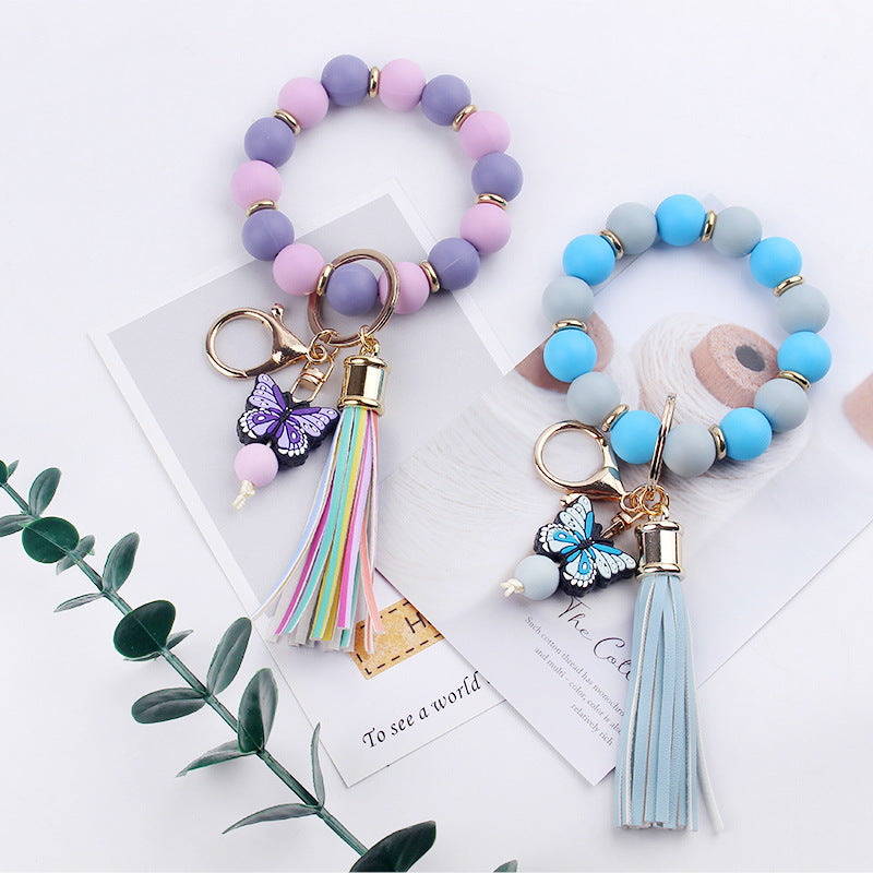 Llavero de pulsera de mariposa de dibujos animados hecho a mano con cuentas, creativo