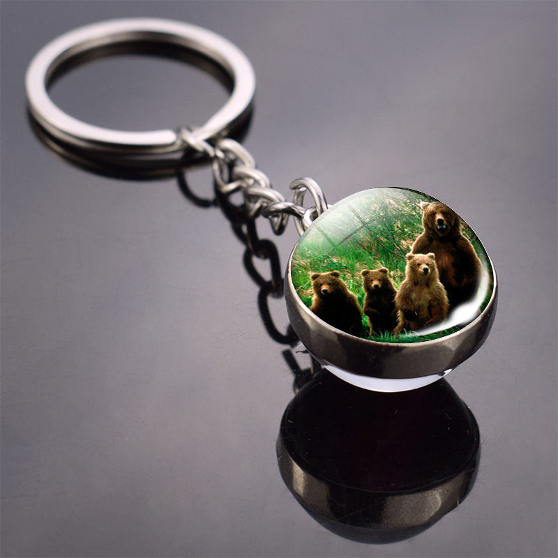 Colgante de bola de cristal con diseño de animales y llavero luminoso de moda