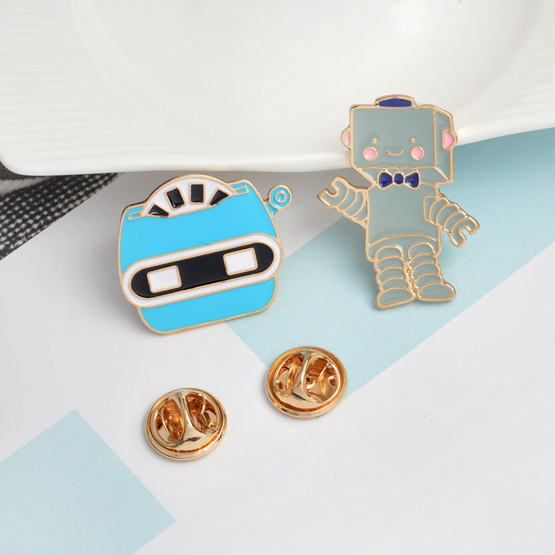Broche de dibujos animados creativo de avión, astronauta, robot y planeta goteando