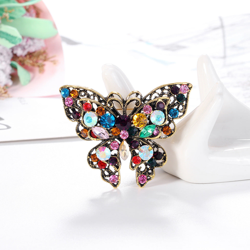 Broche de mariposa de moda con diamantes de imitación de colores