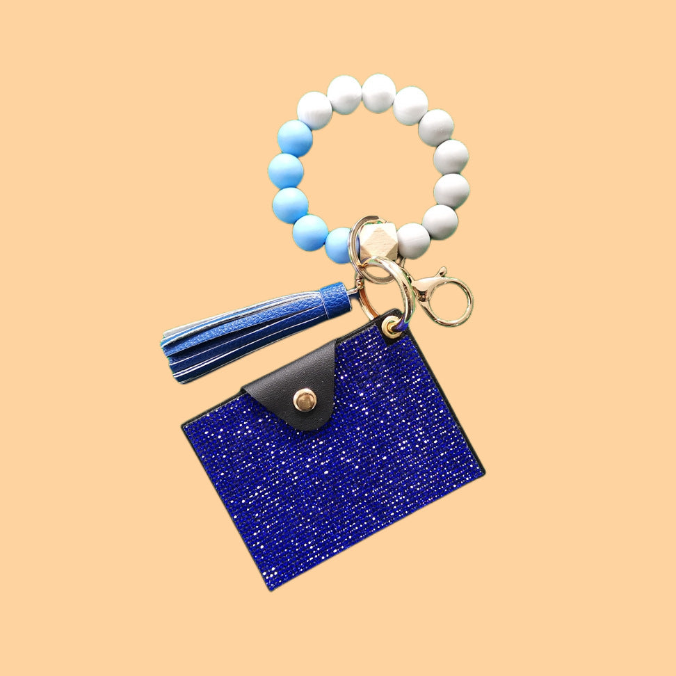 Pulsera de cuentas de silicona con borla y letra, y bolsa de diamantes de imitación