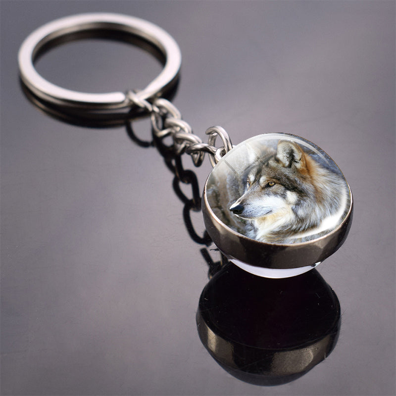 Colgante de bola de cristal con diseño de animales y llavero luminoso de moda