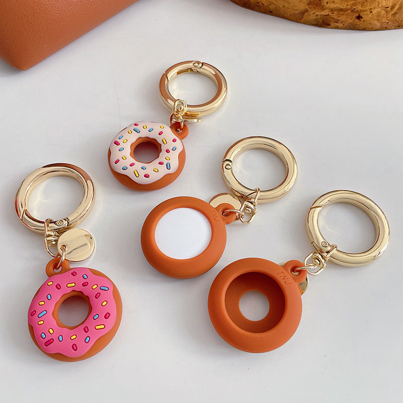 Funda protectora de silicona creativa para localizador de donas