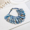 Handgewebtes rundes Muschelschuppen-Armband