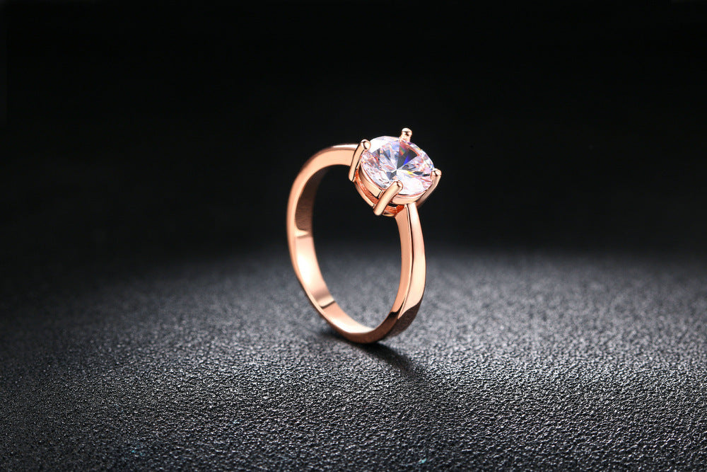 Anillo de oro rosado y circonita