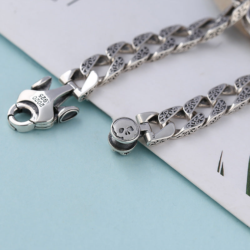 Pulsera de plata de ley con adorno para hombre, diseño de calavera giratoria, estilo retro y patrón de hierba china
