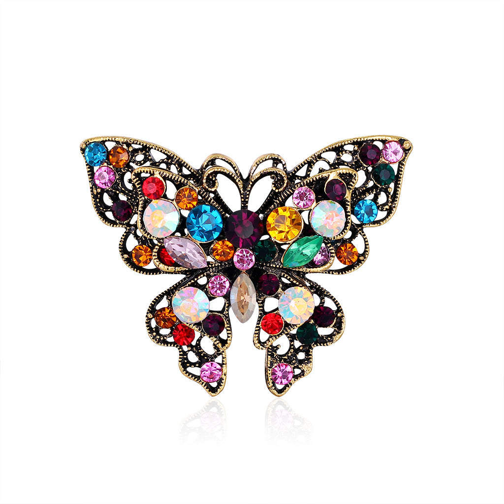 Broche de mariposa de moda con diamantes de imitación de colores