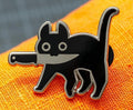 Insignia de vaquero Gato negro con cuchillo
