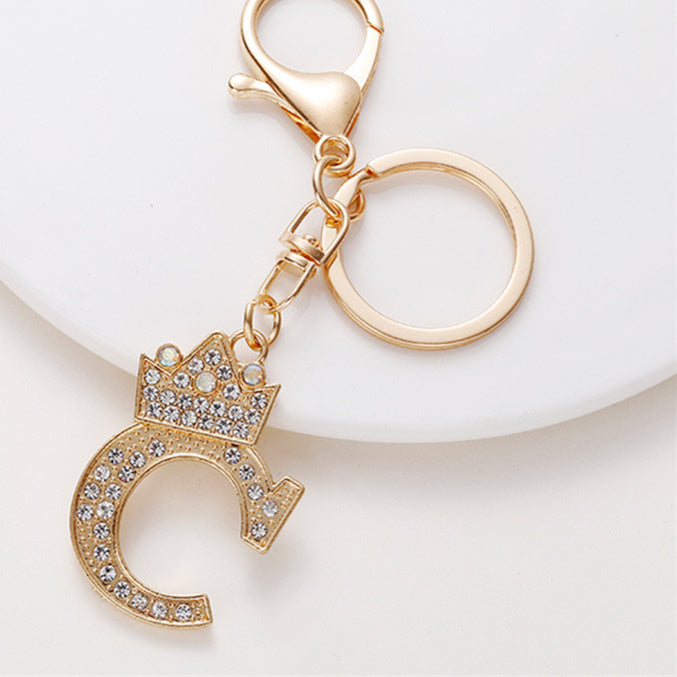Llavero de metal con incrustaciones de diamantes y el alfabeto de la corona inglesa de 26 letras