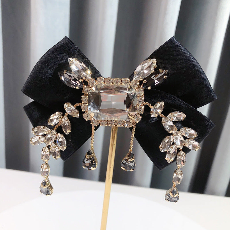 Broche de lazo británico vintage sólido de diamantes de imitación