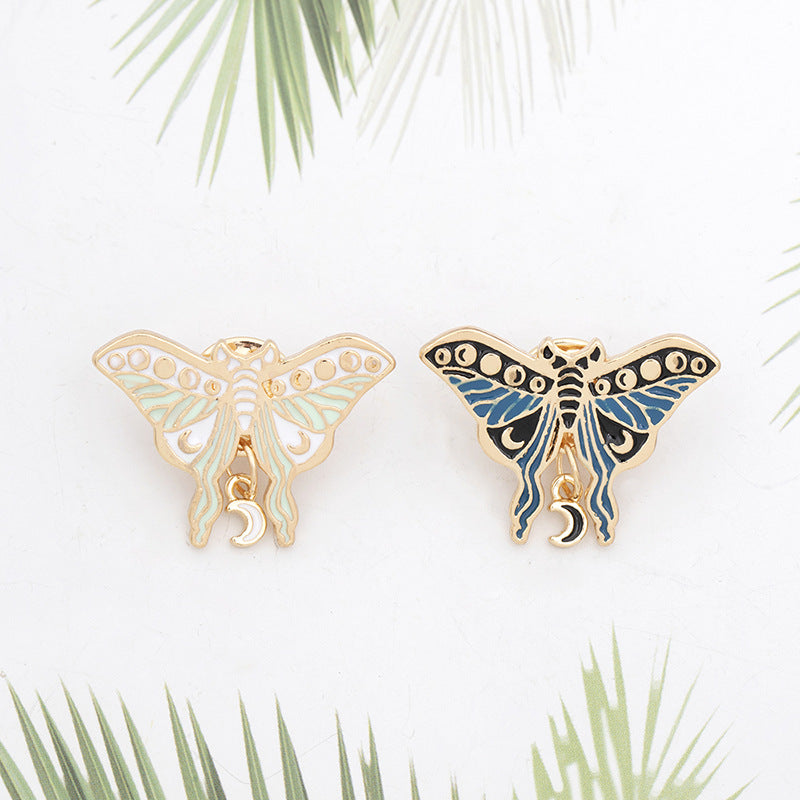 Broche de pintura con forma de mariposa y polilla con goteo de aceite creativo