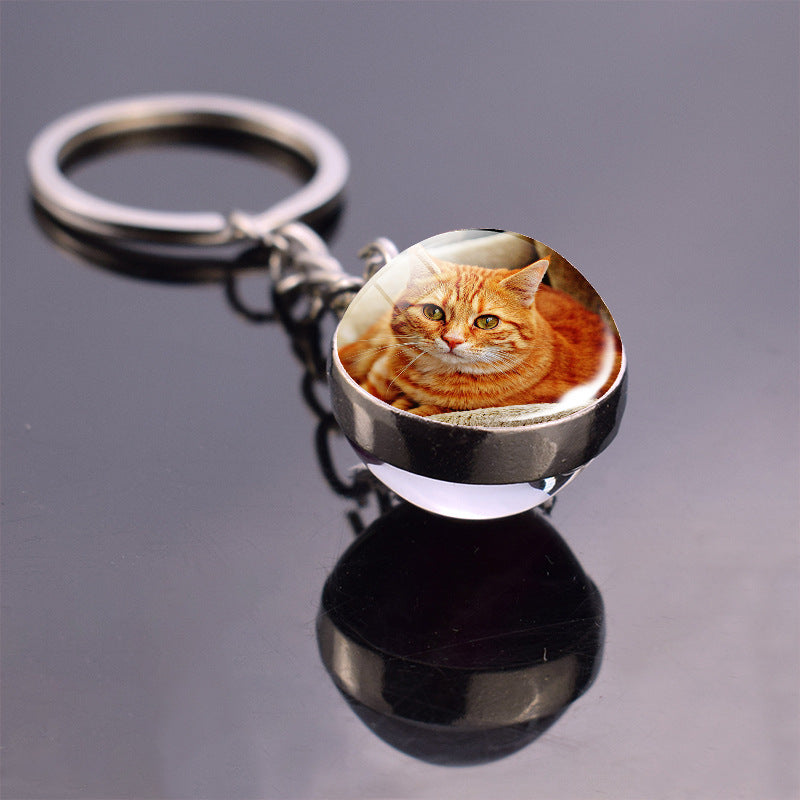 Colgante de bola de cristal con diseño de animales y llavero luminoso de moda