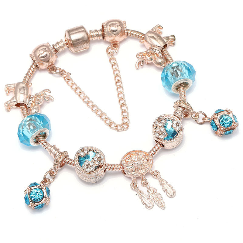 Pulsera de mujer con dije de borla magnética color oro rosado