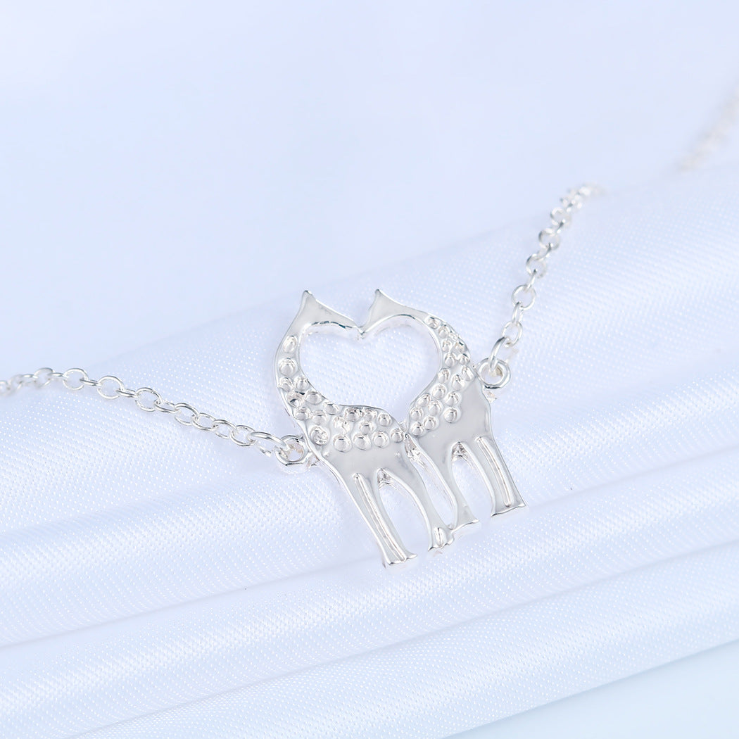 Vergoldete Silberarmbänder mit Liebesherz-Giraffen
