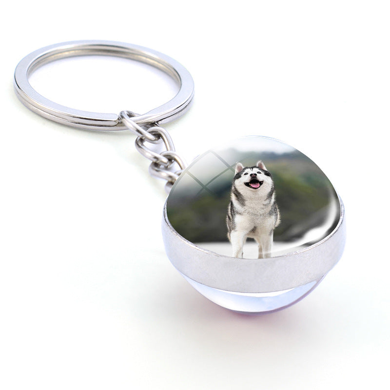 Colgante de bola de cristal con diseño de animales y llavero luminoso de moda