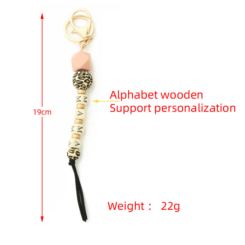 Llavero de cadena de leopardo con colgante de silicona con letras de madera y oblea