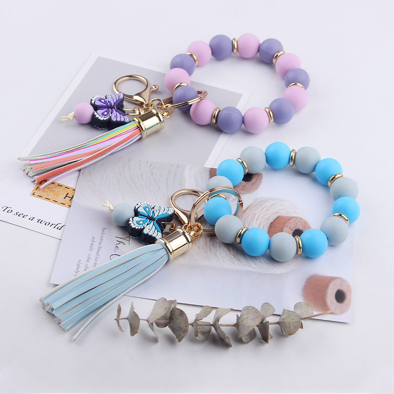 Llavero de pulsera de mariposa de dibujos animados hecho a mano con cuentas, creativo