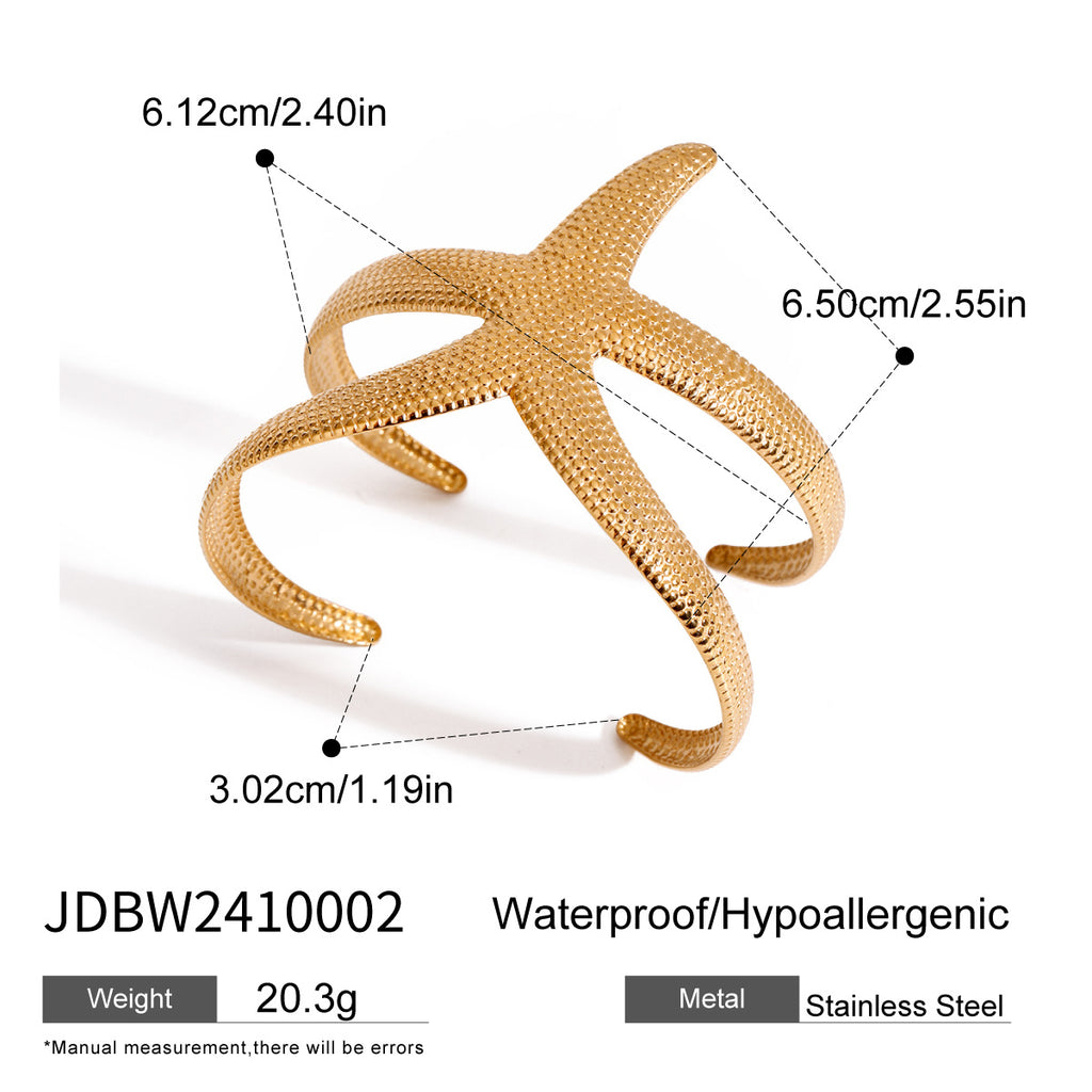 Pulsera abierta de estrella de mar martillada de acero inoxidable