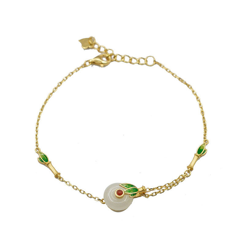 Pulsera de lujo ligero de estilo retro de hadas, de jade hetian con incrustaciones de oro antiguo y hebilla de la paz esmaltada.