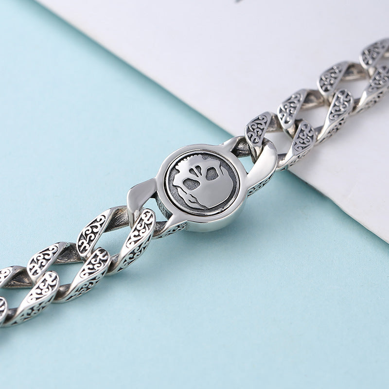Pulsera de plata de ley con adorno para hombre, diseño de calavera giratoria, estilo retro y patrón de hierba china