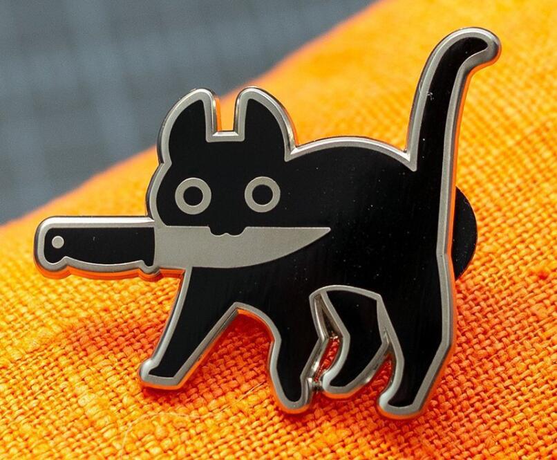 Insignia de vaquero Gato negro con cuchillo