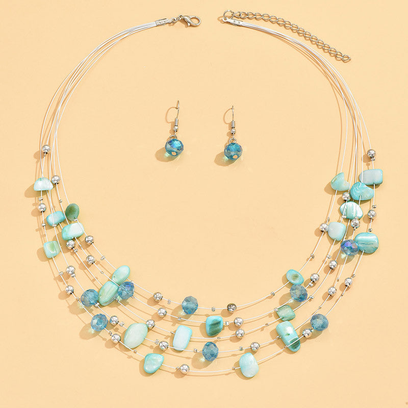 Conjunto de pendientes y collar bohemio de varias capas con conchas y cristales