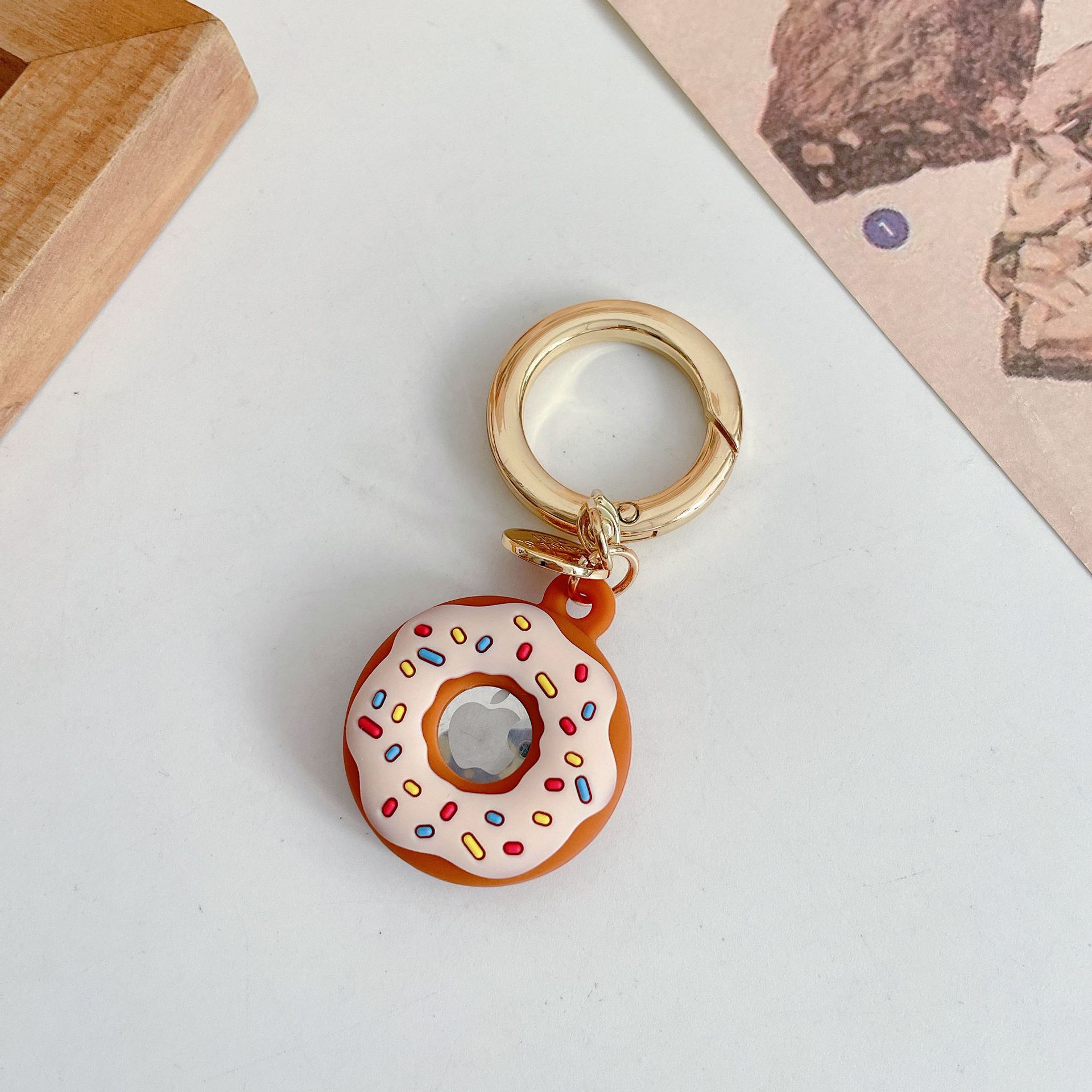 Funda protectora de silicona creativa para localizador de donas