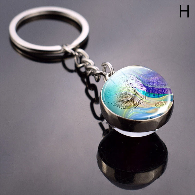 Llavero de bola de cristal con estrella de mar tortuga y animal divertido