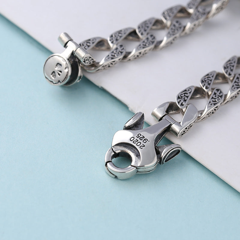 Pulsera de plata de ley con adorno para hombre, diseño de calavera giratoria, estilo retro y patrón de hierba china