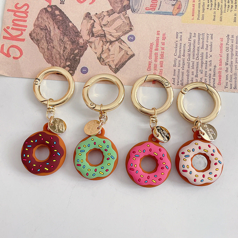 Funda protectora de silicona creativa para localizador de donas