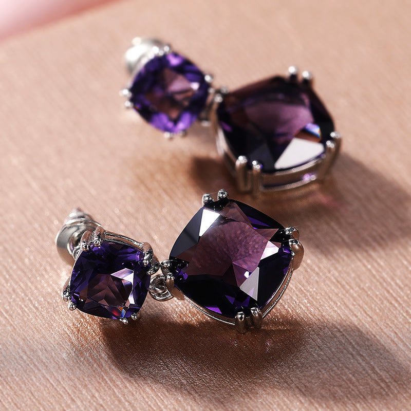 Elegantes aretes cuadrados de circonita morada misteriosa