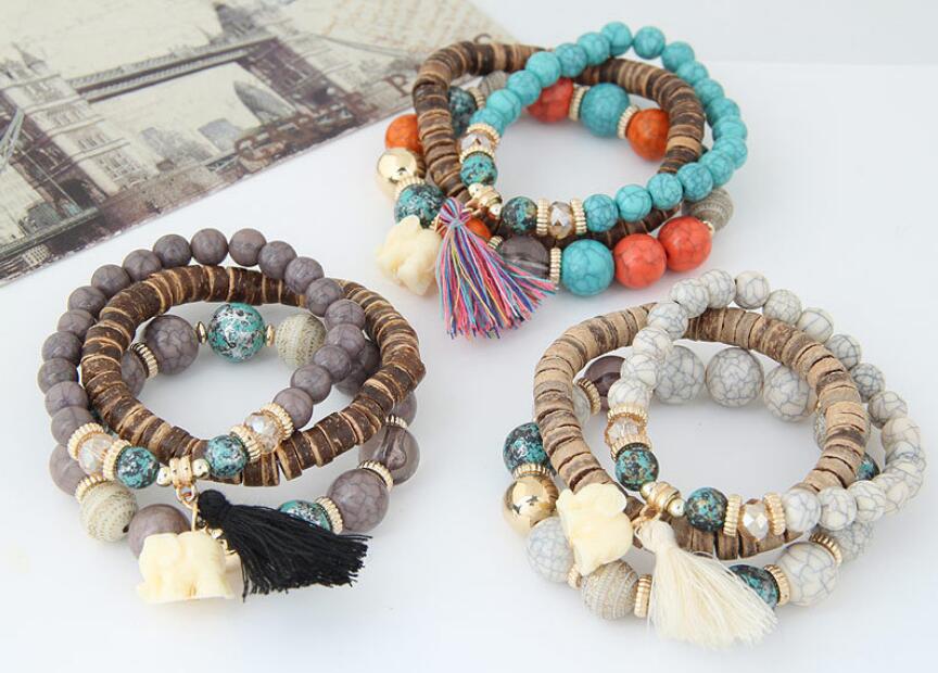 Brazalete de elefante bebé con borlas de cuentas de madera y varias capas