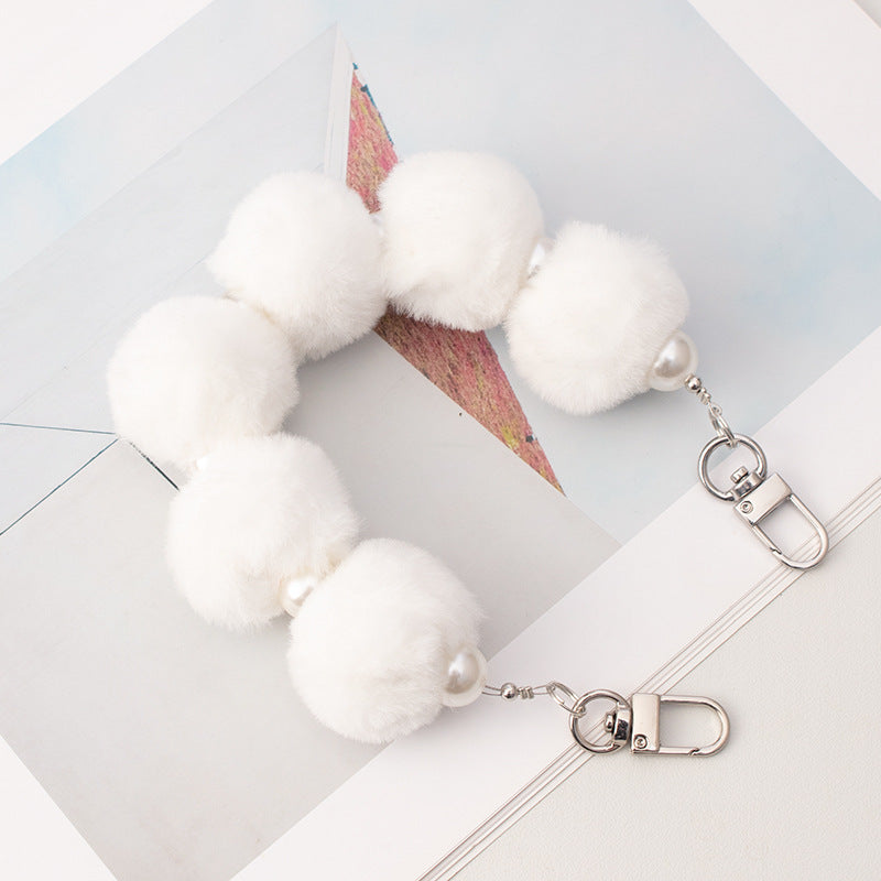 Cordón de peluche para teléfono móvil con bola de pelo