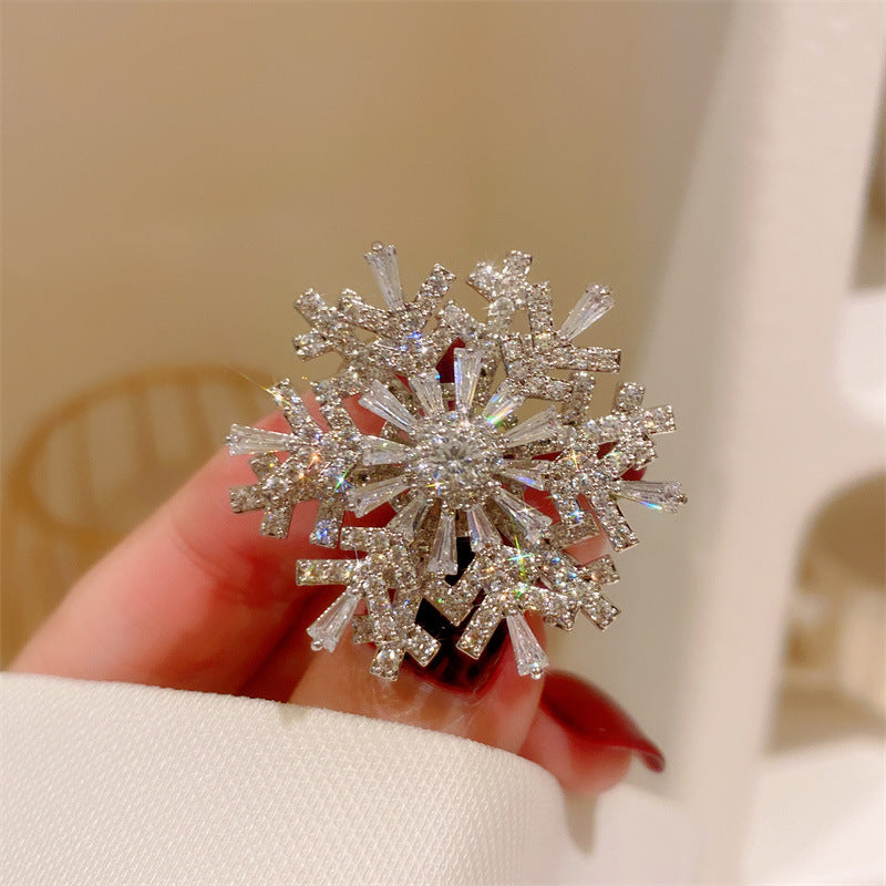 Broche giratorio de circonitas de copo de nieve estéreo Advanced Sense