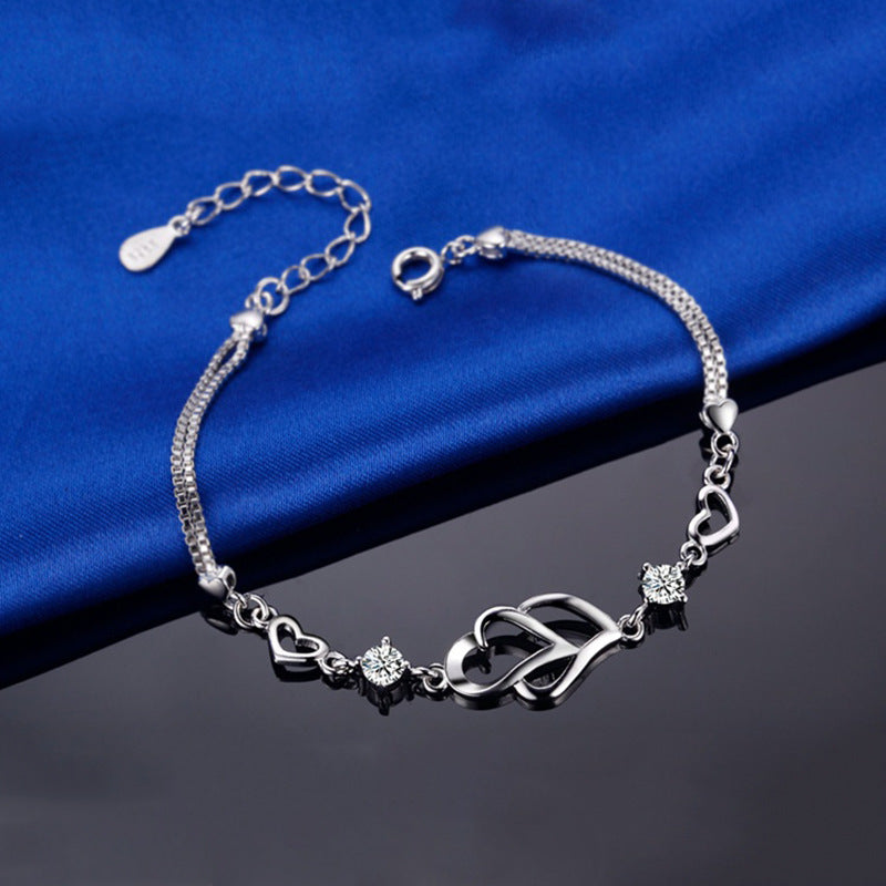 Weißes Kupfer versilbertes herzförmiges Armband Herz an Herz Diamant