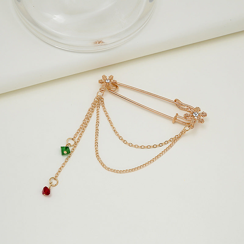 Broche de moda con cadena y cascabel