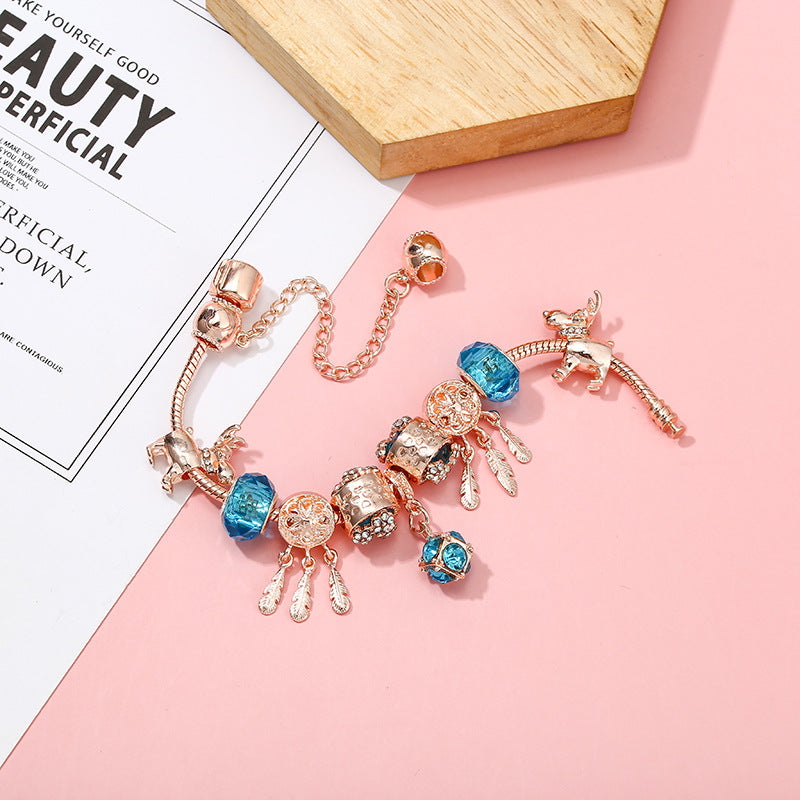 Pulsera de mujer con dije de borla magnética color oro rosado