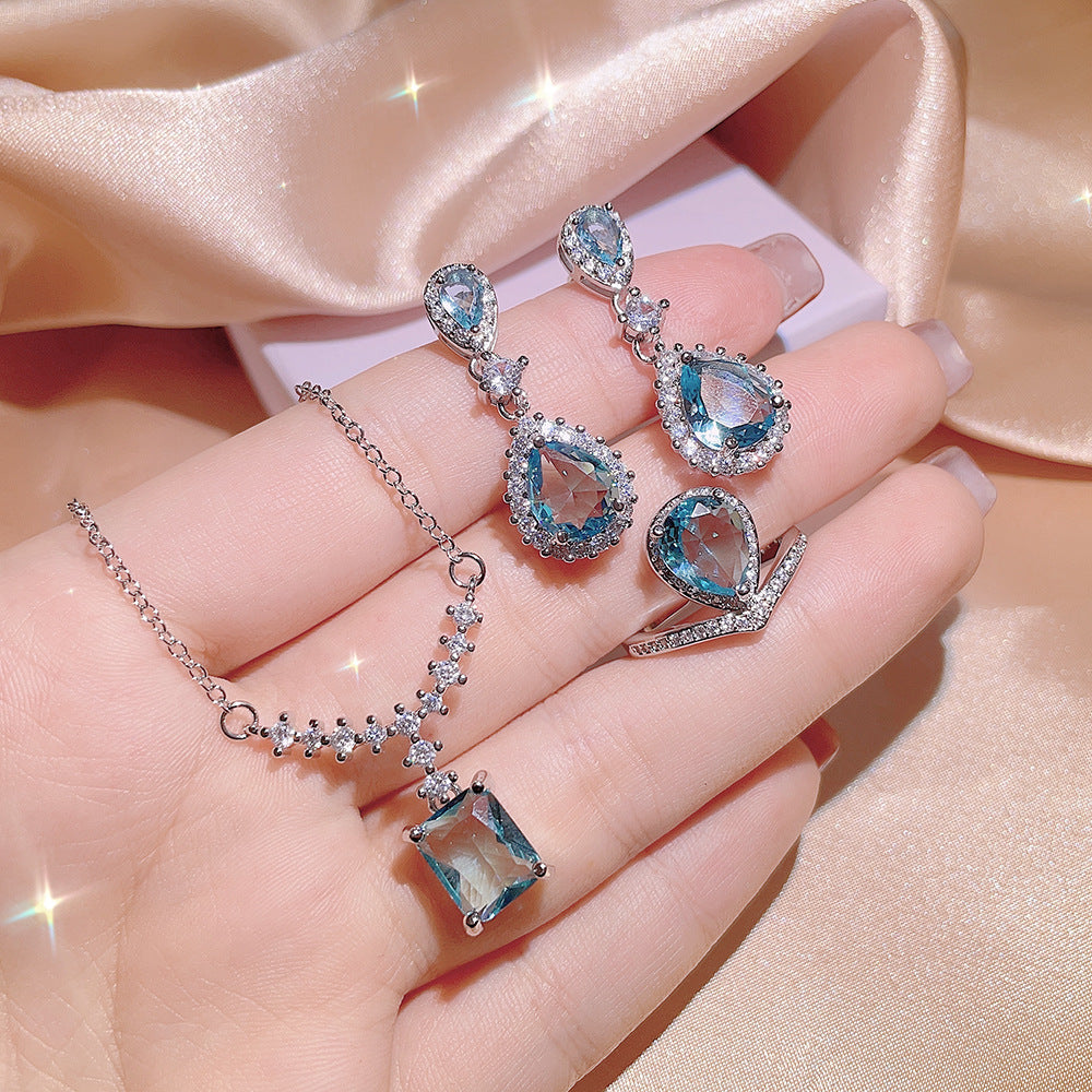 Damen-Schmuckset mit blauen Zirkonen (Ring, Ohrringe, Halskette)