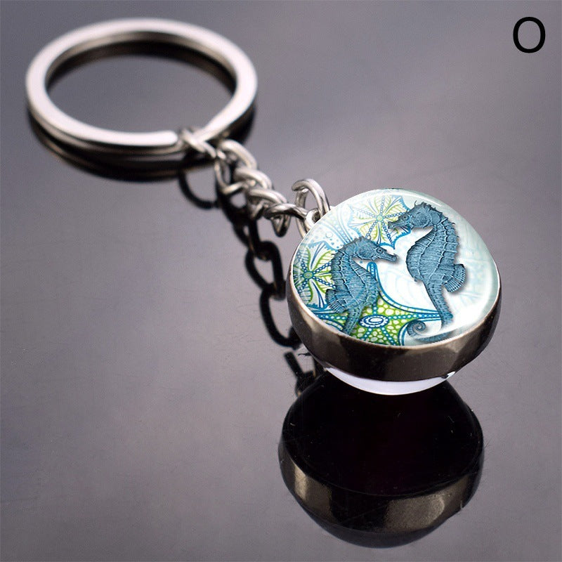 Llavero de bola de cristal con estrella de mar tortuga y animal divertido