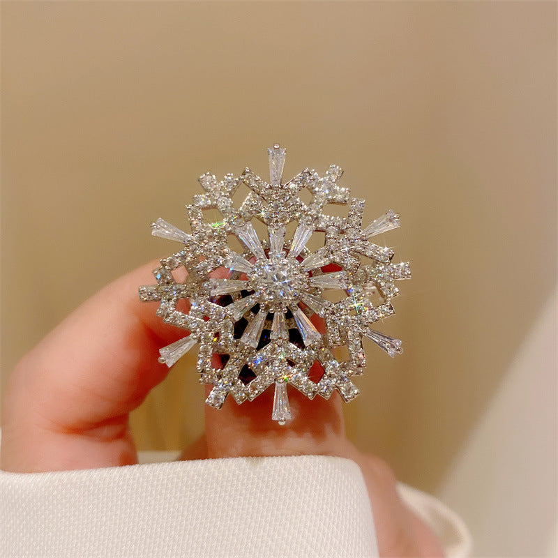 Broche giratorio de circonitas de copo de nieve estéreo Advanced Sense
