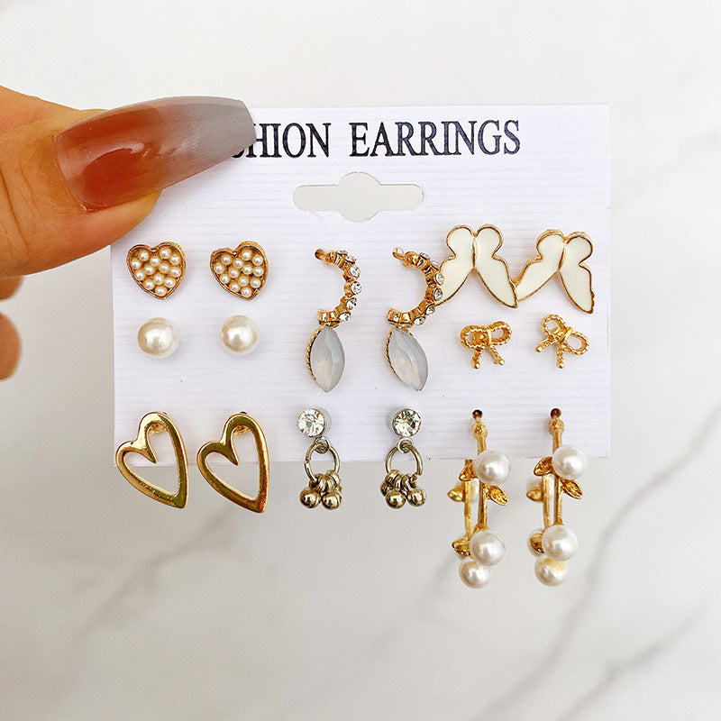 Juego de aretes de 9 pares con diseño de mariposa y corazón calado