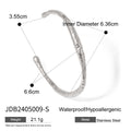 Pulsera de acero inoxidable con textura irregular esférica y diseño abierto
