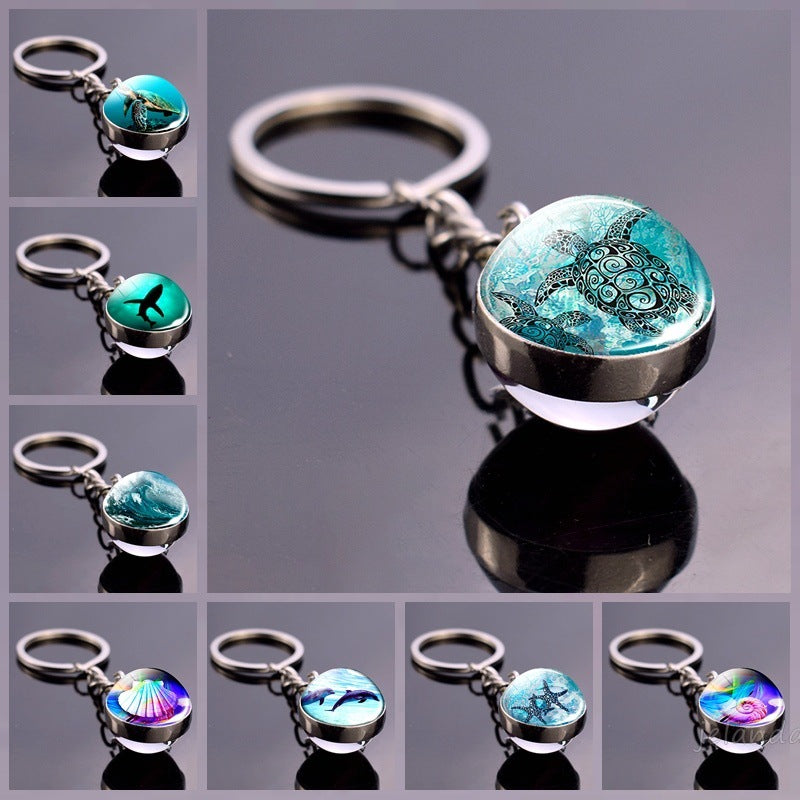 Llavero de bola de cristal con estrella de mar tortuga y animal divertido
