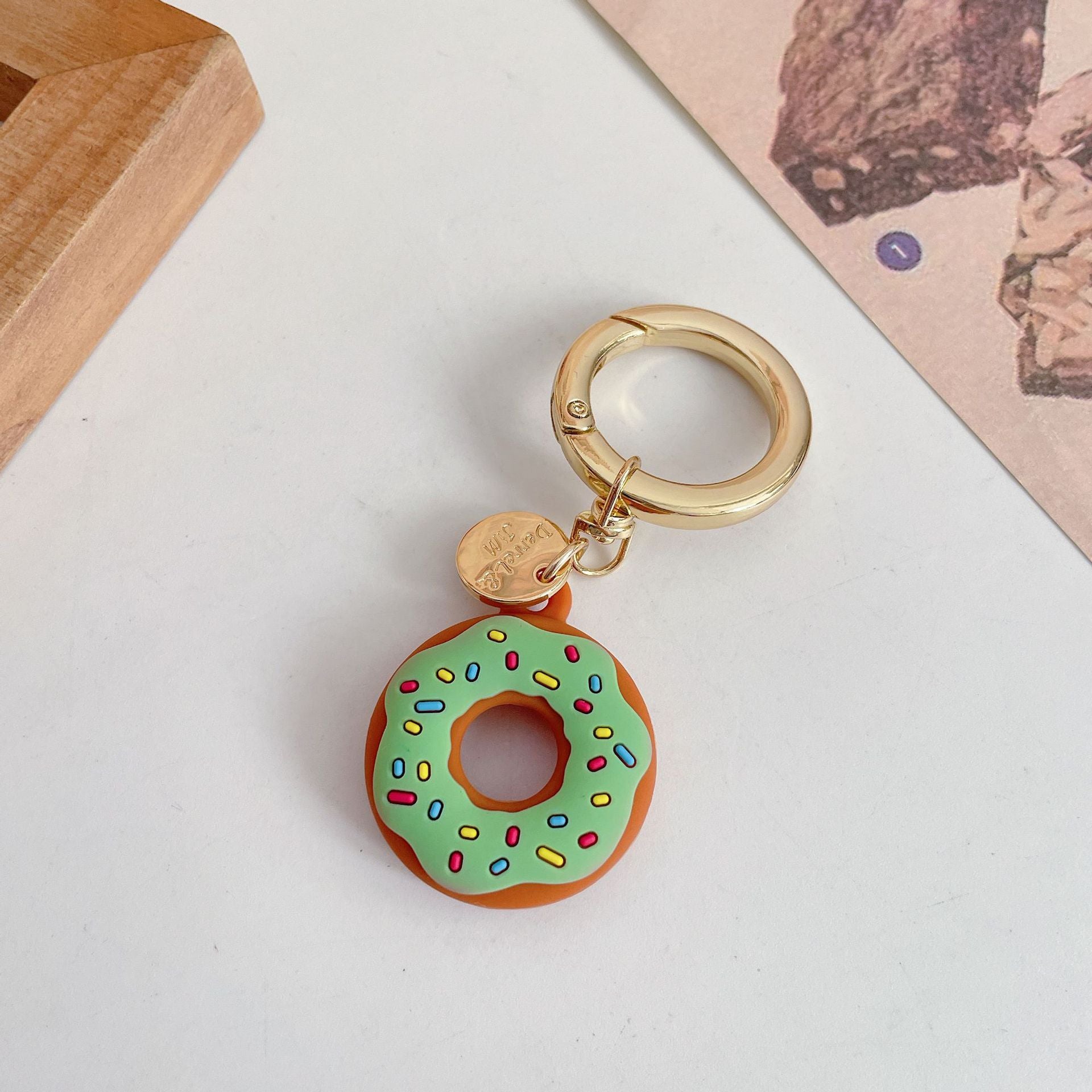 Funda protectora de silicona creativa para localizador de donas