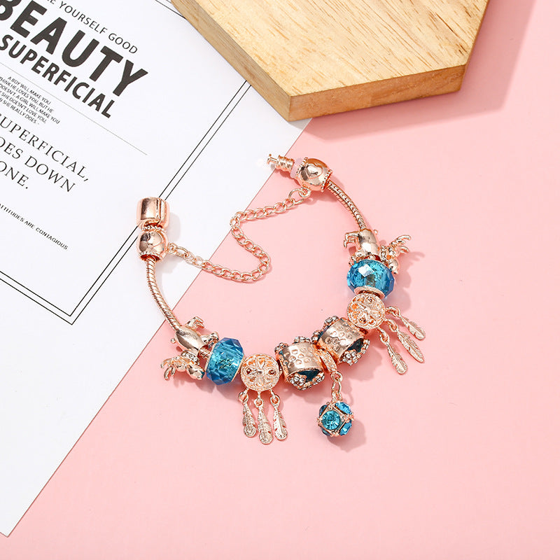 Pulsera de mujer con dije de borla magnética color oro rosado