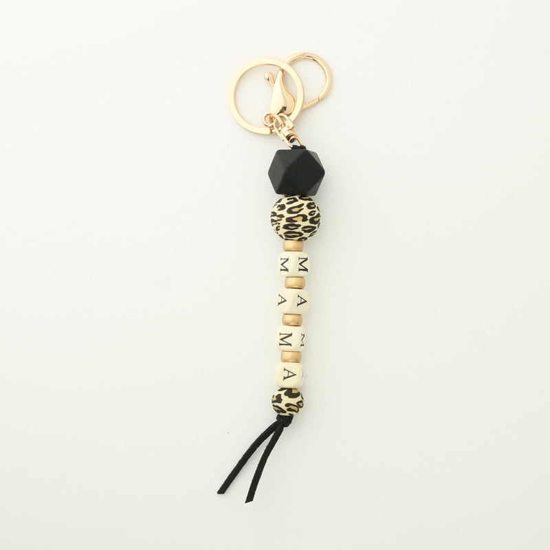 Llavero de cadena de leopardo con colgante de silicona con letras de madera y oblea