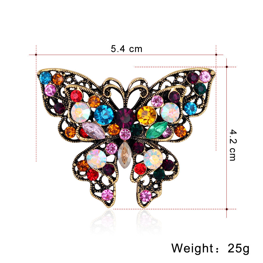 Broche de mariposa de moda con diamantes de imitación de colores