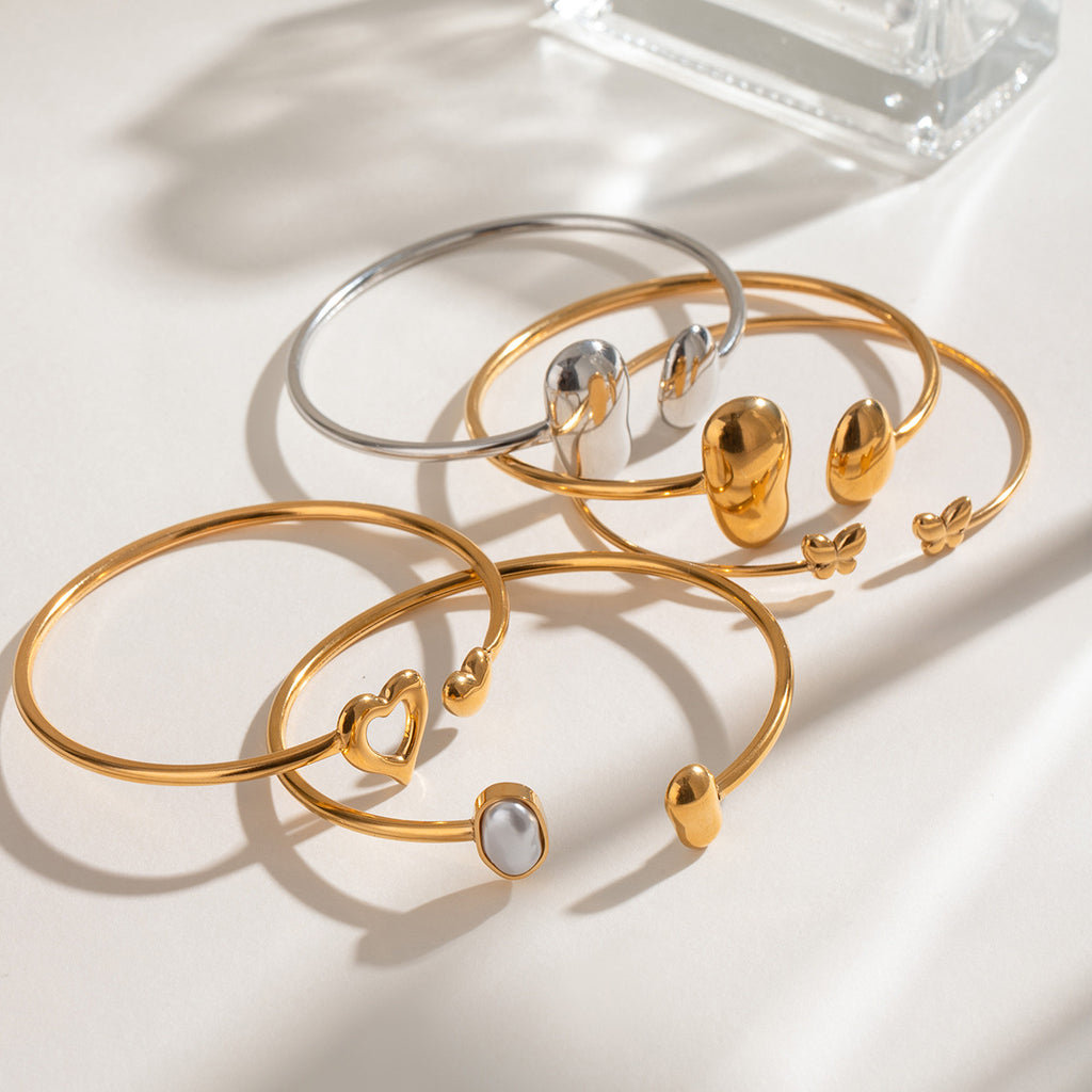 Pulsera abierta de acero inoxidable con forma de gota de agua irregular
