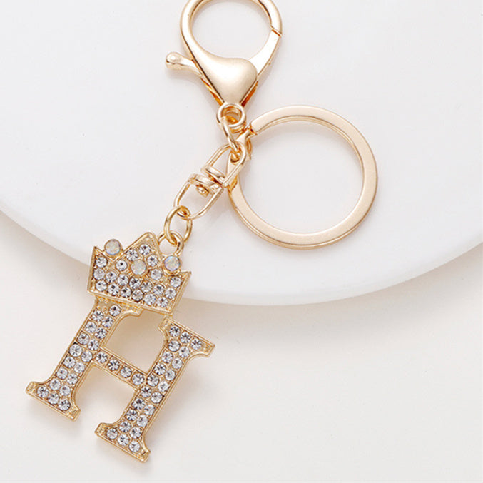 Llavero de metal con incrustaciones de diamantes y el alfabeto de la corona inglesa de 26 letras